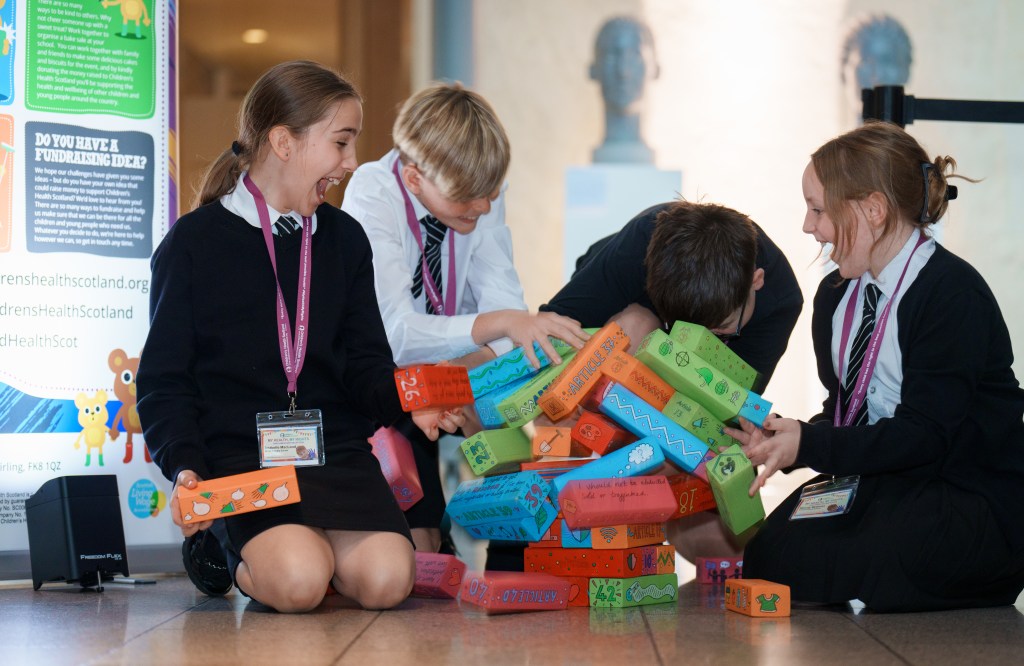 Health Rights Defenders playing Rights Jenga at Scottish Parliament.