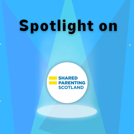 'Spotlight on" shining down on Shared parenting Scotland lol with three spotlights and four stars in the background.