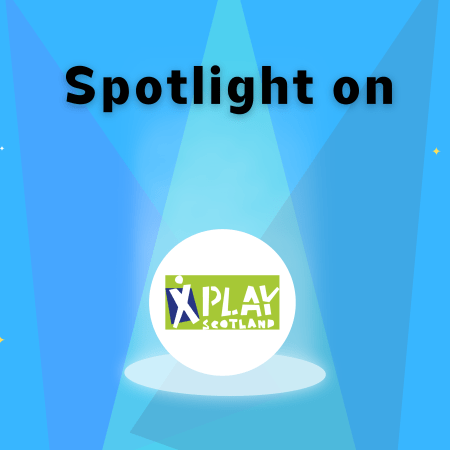Play Scotland Banner. "Spotlight on" with three spotlights shining down on Paly Scotland logo and four stars in the background.